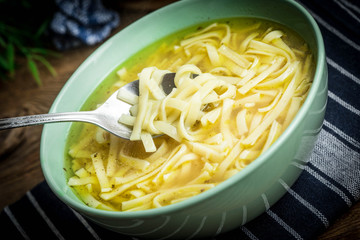 Broth - chicken soup in a bowl.