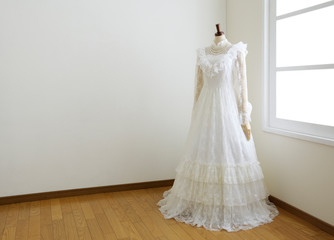 Fototapeta na wymiar wedding dress in white room