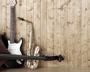 Saxophone guitar and bass in the room