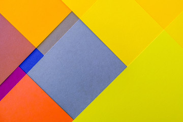 double exposure of plain geometric graphic background with colored paper