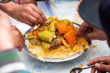 Couscous Bidaoui. Moroccan couscous with chicken & 7 seven vegetables - carrots, leeks, courgettes, tomatoes, squash, turnips, potatoes.