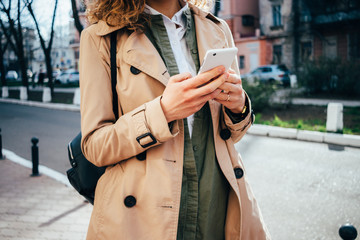Young woman using smart phone outdoors