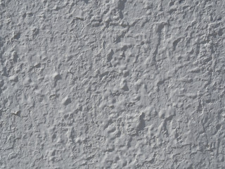 Texture of white uneven plaster. Background and pattern
