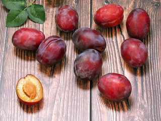 Plums on a light background. Summer vitamins