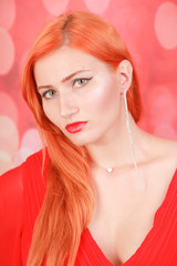 holiday woman in red dress over christmas studio background