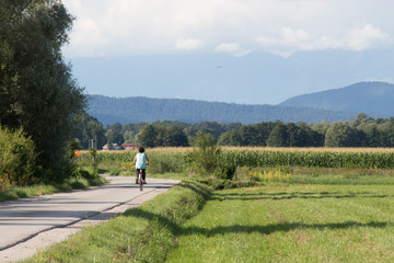 woman on the bicycle on the road