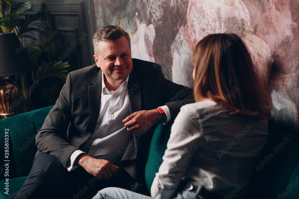 Wall mural portrait of a businessman talking with woman. business and success concept.