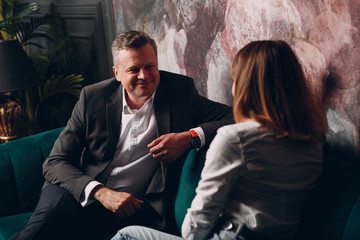 Portrait of a businessman talking with woman. Business and success concept.