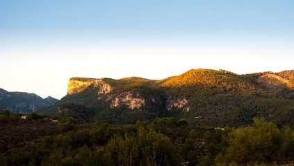 last rays of sun over the mountain