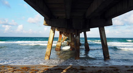 turquoise water under pier at the beach in Lauderdale Florida, tropical paradise
