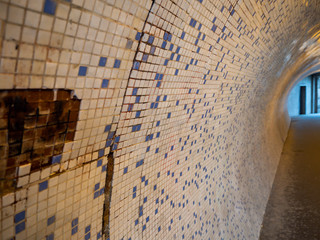 Old mosaic tunnel under the Széchenyi Chain Bridge, Budapest Hungary. Partial focusing with blur background