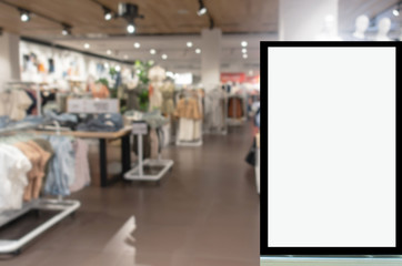 advertising light box or blank showcase billboard for your text message or media content with blurred image popular women fashion clothes shop showcase in shopping mall, commercial, marketing concept