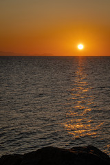 A sunset view from the rocky coast of Cefalu
