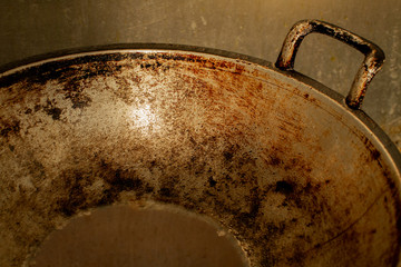 Old traditional cast iron for cooking stir fry food