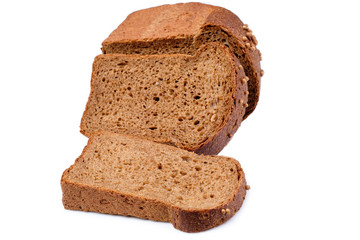 loaf of dark bread partly cut in slices, isolated on white