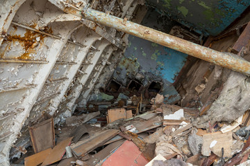 Internal parts of decommissioned marine ship that was cut and left on the shore.