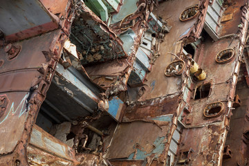 Internal parts of decommissioned marine ship that was cut and left on the shore.