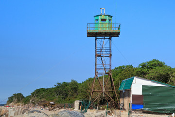 Old observation tower on the sand beach in the Baltic Sea coast.