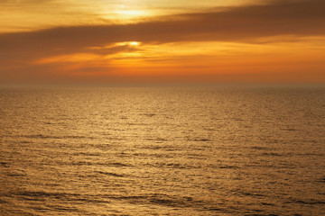 Beautiful sunset seascape with calm water.