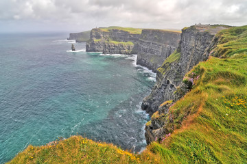 The Cliffs of Moher located at the southwestern edge of the Burren region in County Clare, Ireland - obrazy, fototapety, plakaty
