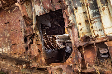 Internal parts of decommissioned marine ship that was cut and left on the shore.