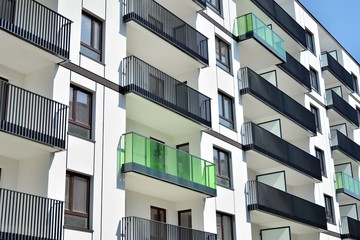 Modern apartment buildings on a sunny day with a blue sky. Facade of a modern apartment building