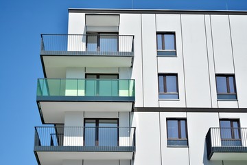 Modern apartment buildings on a sunny day with a blue sky. Facade of a modern apartment building