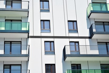 Modern apartment buildings on a sunny day with a blue sky. Facade of a modern apartment building
