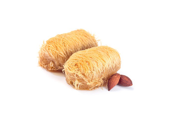 Two greek pastry Kataifi with shredded filo dough stuffed with almond nuts, in honey syrup, isolated on a white