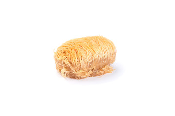 Greek pastry Kataifi with shredded filo dough stuffed with almond nuts, in honey syrup, isolated on  white