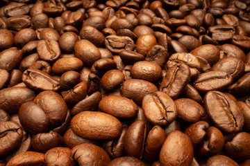 Very big roasted brown coffee beans background