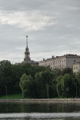 Fototapeta na wymiar Svisloch river and soviet building in Minsk, Belarus