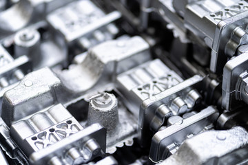Naklejka premium Pile of aluminum automotive parts, casting process in the automotive factory