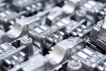 Pile of aluminum automotive parts, casting process in the automotive factory