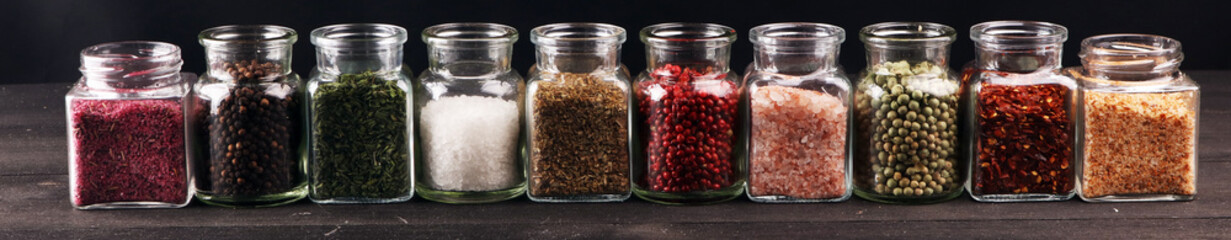 assortment of spices in glass on table. Food and cuisine ingredients and peppers