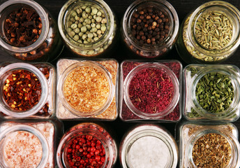 assortment of spices in glass on table. Food and cuisine ingredients and peppers