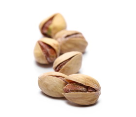 Macro pistachios isolated on white background