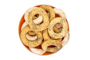 Plate with dried bagels on white.