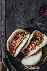 Steamed bao buns with vegetables.
