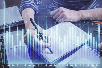 Financial chart drawn over hands taking notes background. Concept of research. Double exposure