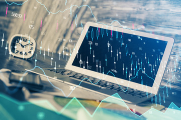 Double exposure of graph and financial info and work space with computer background. Concept of...