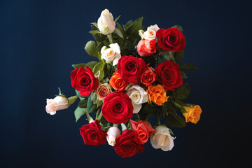 top view bouquet of roses on blue background