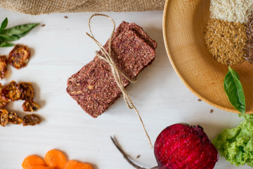 Ukrainian Crispbread  with beetroot and tomato. Healthy diet food. Bread cakes on a white background in the ingredient seasoning.