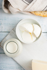 dairy products on old white wooden table