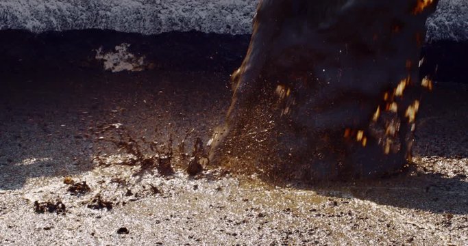 Slow Motion Close Up Of A Pipe Is Pumping Organic Cow  Manure Compost  Used For Agricultural Soil Cultivation And For Biogas, Renewable Sources Of Energy.