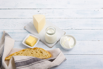 dairy products on old white wooden table