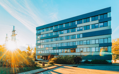 EU Corporate business office and street on background sun light