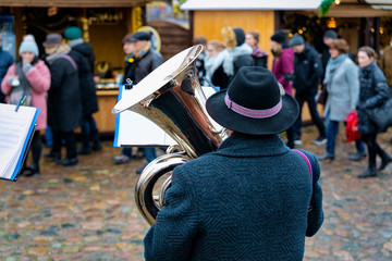 Man playing trumpets Christmas market in Charlottenburg Berlin © Roman Babakin