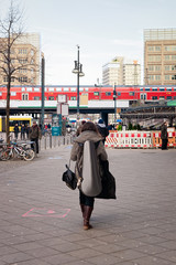 Lady with guitar in street in city center on Alexanderplatz