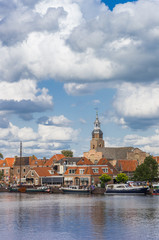 Boats and church tower of historic village Blokzijl, Netherlands